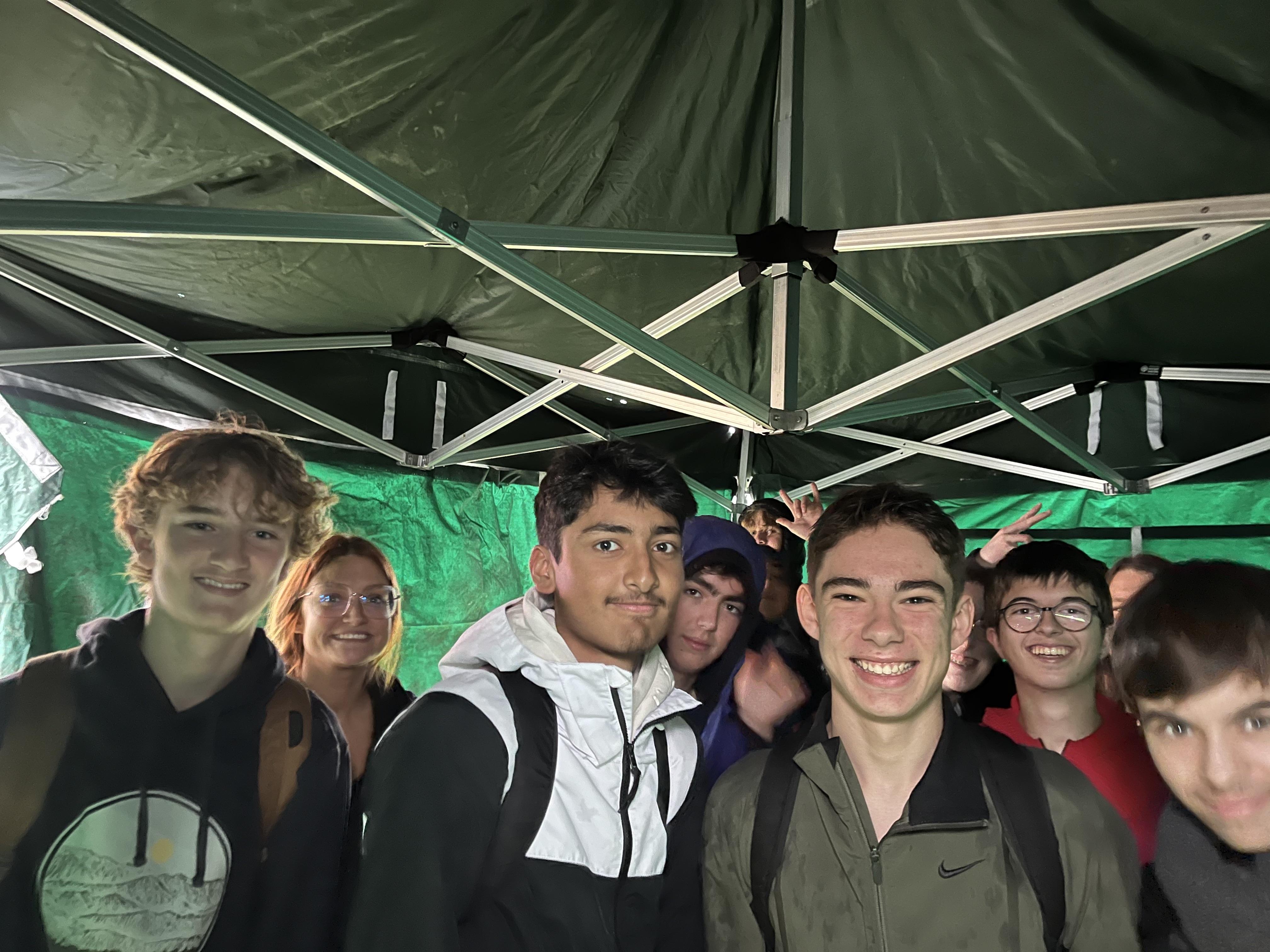 students in tent smiling