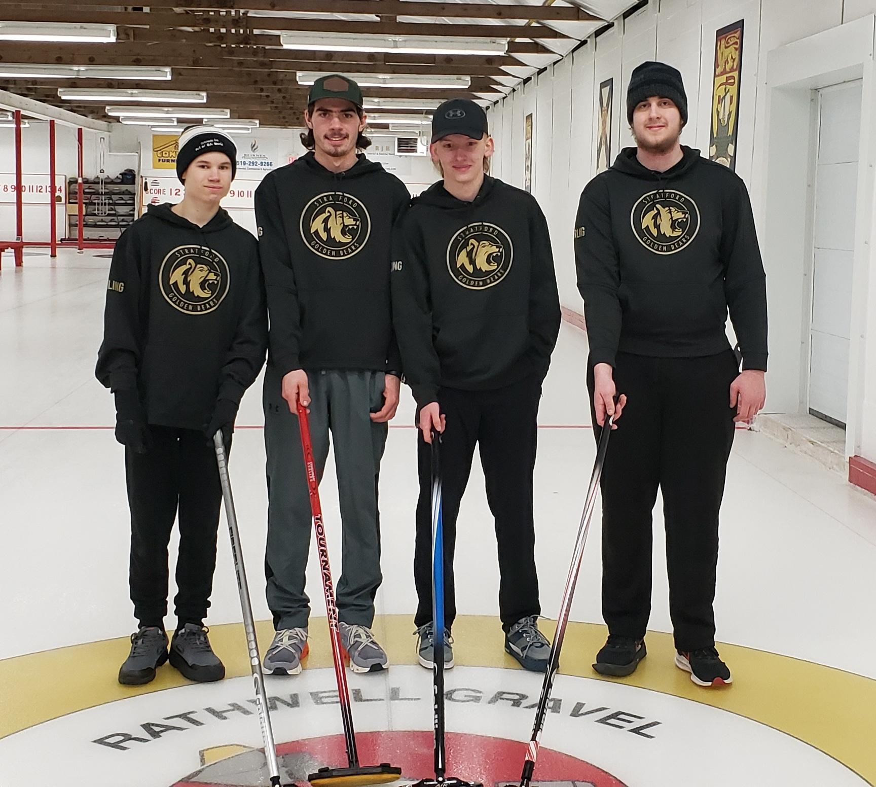 male curlers posing on rink